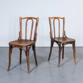 Chaises de salle à manger en chêne chaud à dossier arrondi Fischel des années 1950 - Paire